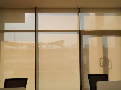 Sunscreen Roller Blinds in a restaurant setting, filtering natural light